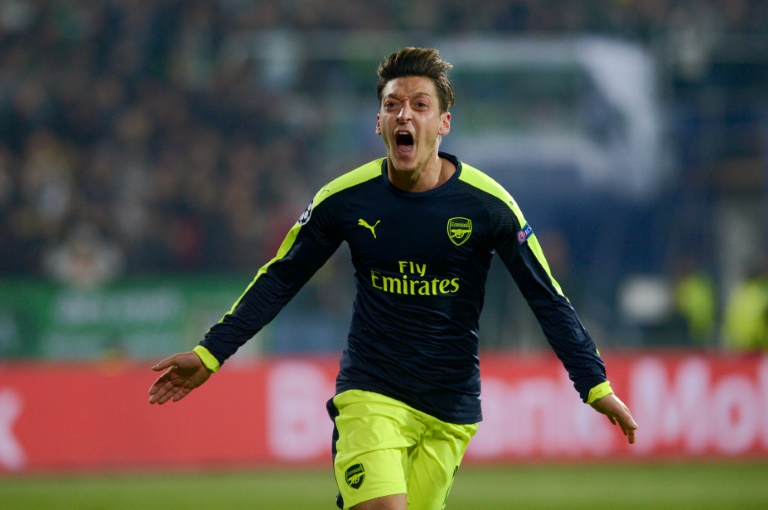 Arsenal through as Ozil crowns epic comeback